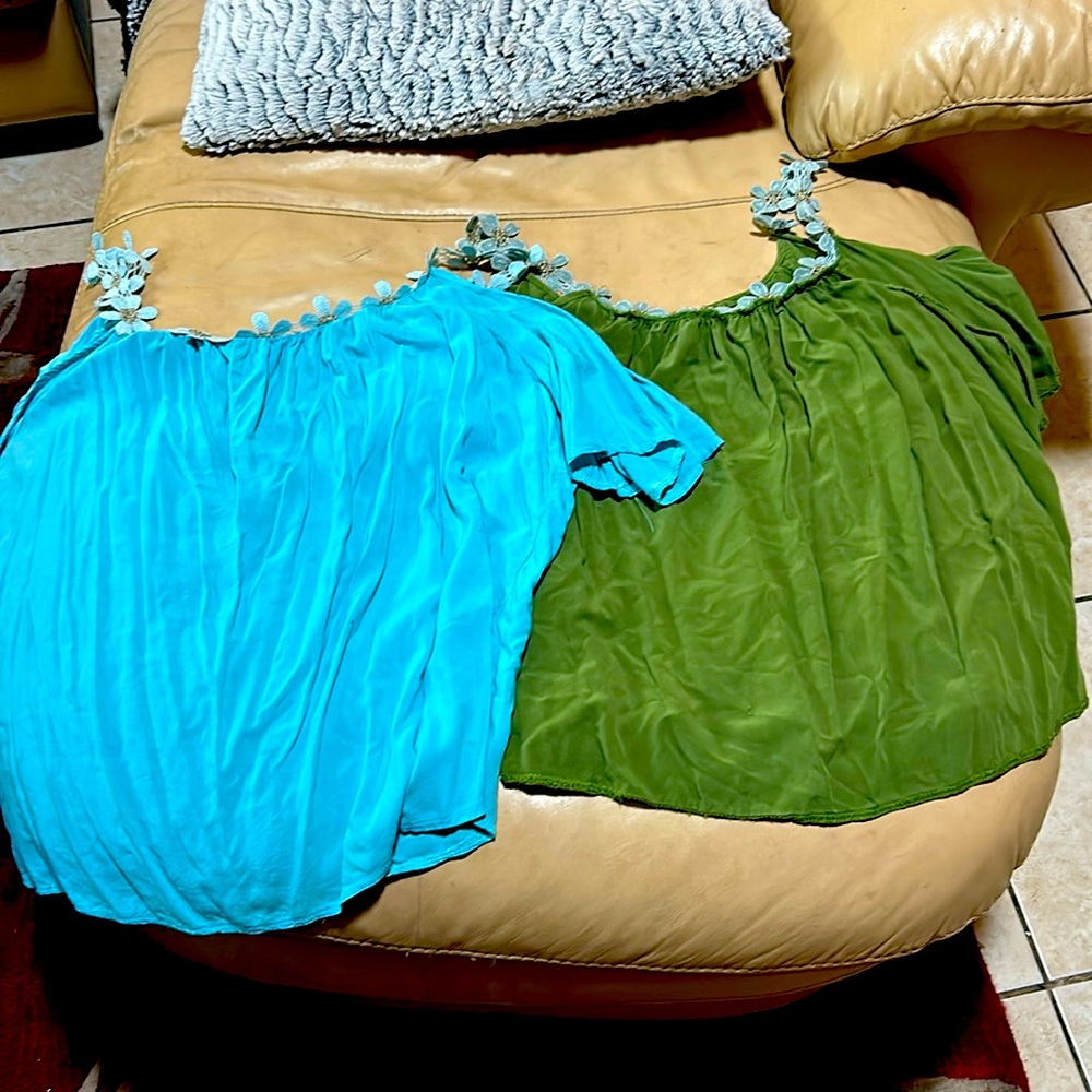 I don’t know what brand they are but they are two crop tops.